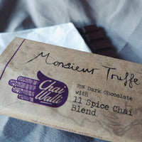 The Chai Walli Chai Cholcolate wrapper with Monsieur Truffle written on it along with the Chai Walli logo in purple