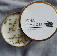 Top view of the Chai Walli Chai Candle with the lid undone showing a partial view of the candle inside